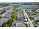 Aerial perspective of residences with lush greenery, creating a harmonious blend of nature and architecture at 7417 Sungold Meadow Ct, Apollo Beach, FL 33572
