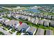 Aerial view of a residential community with a lake and easy access to the highway and surrounding area at 7417 Sungold Meadow Ct, Apollo Beach, FL 33572