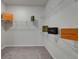 Neatly organized walk-in closet showcasing ample shelving space for your bags, clothes, and accessories at 7417 Sungold Meadow Ct, Apollo Beach, FL 33572
