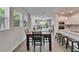 Inviting dining area with natural light, view of the living space and stainless kitchen appliances at 7417 Sungold Meadow Ct, Apollo Beach, FL 33572