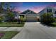 Charming single-Gathering home featuring a well-manicured front yard and a two-car garage at 7417 Sungold Meadow Ct, Apollo Beach, FL 33572