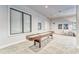 Cozy game room featuring a shuffleboard table and views of the exterior at 7417 Sungold Meadow Ct, Apollo Beach, FL 33572