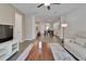 Open floor plan living room with views of the dining area and modern floors throughout at 7417 Sungold Meadow Ct, Apollo Beach, FL 33572