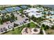 Aerial view of the recreation area, showcasing parking, the clubhouse, pool, and playground at 7417 Sungold Meadow Ct, Apollo Beach, FL 33572