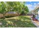 Large backyard showcasing mature trees and a privacy fence, perfect for outdoor enjoyment at 7747 90Th N Way, Seminole, FL 33777
