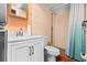 Bathroom featuring a modern vanity, toilet, and a walk-in shower with updated fixtures at 7747 90Th N Way, Seminole, FL 33777