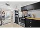 Eat-in kitchen with a stainless steel oven, bright white subway tile backsplash and butcher block countertops at 7747 90Th N Way, Seminole, FL 33777