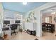 Bright office space with a computer workstation that flows into the dining room at 7747 90Th N Way, Seminole, FL 33777