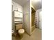 Bathroom featuring an older toilet, shower and linen closet at 7939 Pine Dr # 7939, Temple Terrace, FL 33637