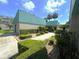 Clubhouse with vibrant landscaping at 7939 Pine Dr # 7939, Temple Terrace, FL 33637