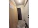 Tiled entryway featuring a utility closet and a door that leads outside at 7939 Pine Dr # 7939, Temple Terrace, FL 33637