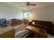 Living room with a sofa, coffee table, and large window, creating a relaxing area at 7939 Pine Dr # 7939, Temple Terrace, FL 33637