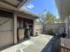 Outdoor patio with shed, storage shelving, and wooden fence at 7939 Pine Dr # 7939, Temple Terrace, FL 33637