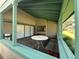 Outdoor patio featuring picnic table and sliding glass doors at 7939 Pine Dr # 7939, Temple Terrace, FL 33637