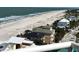 Aerial view from the balcony showcasing the beach, ocean, and surrounding community at 880 Mandalay Ave # N1004, Clearwater Beach, FL 33767