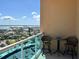 Inviting balcony seating area offers spectacular views of the bay and surrounding neighborhood at 880 Mandalay Ave # N1004, Clearwater Beach, FL 33767