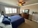Bedroom view features a comfortable bed, dresser, and a window with bright light at 880 Mandalay Ave # N1004, Clearwater Beach, FL 33767