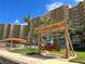 Comfortable outdoor swing in the community area near the community building and the beach at 880 Mandalay Ave # N1004, Clearwater Beach, FL 33767