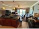 Open living space features a comfortable couch with access to the balcony at 880 Mandalay Ave # N1004, Clearwater Beach, FL 33767