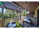 Relaxing condo balcony with outdoor seating and scenic water views, perfect for enjoying nature at 880 S Village N Dr # 202, St Petersburg, FL 33716