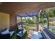 Condo balcony with patio furniture, lovely green outdoor carpet and lake views at 880 S Village N Dr # 202, St Petersburg, FL 33716