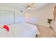 Relaxing bedroom space with cozy decor, and view through the window at 880 S Village N Dr # 202, St Petersburg, FL 33716