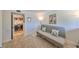 Cozy bedroom with carpet, futon, leading to a laundry area equipped with a washer and dryer at 880 S Village N Dr # 202, St Petersburg, FL 33716
