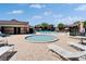 Community pool area featuring a swimming pool, jacuzzi, and lounge seating at 880 S Village N Dr # 202, St Petersburg, FL 33716