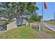 Well-maintained Village Lake Condominiums sign surrounded by lush landscaping at 880 S Village N Dr # 202, St Petersburg, FL 33716