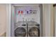 A functional laundry closet with front-loading washer and dryer units at 880 S Village N Dr # 202, St Petersburg, FL 33716