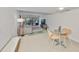 Cozy living room with tile flooring, stylish furniture, and access to a private balcony at 880 S Village N Dr # 202, St Petersburg, FL 33716