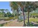 Scenic view of the pond with palm trees and landscaping at this beautiful condominium complex at 880 S Village N Dr # 202, St Petersburg, FL 33716