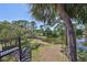 A tranquil pond view from the balcony, accessible by a spiral staircase at 880 S Village N Dr # 202, St Petersburg, FL 33716
