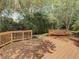 The backyard deck surrounded by mature landscaping provides a private and peaceful outdoor retreat at 8907 Magnolia Chase Cirs, Tampa, FL 33647