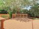 The backyard deck surrounded by mature landscaping provides a private and peaceful outdoor retreat at 8907 Magnolia Chase Cirs, Tampa, FL 33647