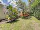 Backyard deck offers a private retreat with mature landscaping and a screened-in pool area at 8907 Magnolia Chase Cirs, Tampa, FL 33647