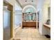 Bright bathroom with a double vanity, a shower with a glass door, and a large soaking tub at 8907 Magnolia Chase Cirs, Tampa, FL 33647