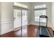 Bright bedroom with hardwood floors and sliding glass doors that lead to a pool at 8907 Magnolia Chase Cirs, Tampa, FL 33647