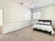 Bedroom featuring neutral carpet, crown molding and a window at 8907 Magnolia Chase Cirs, Tampa, FL 33647