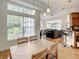 Open-concept dining area offering plenty of natural light and hardwood floors at 8907 Magnolia Chase Cirs, Tampa, FL 33647