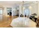 Elegant foyer with an open space concept and hardwood floors, designed for seamless living at 8907 Magnolia Chase Cirs, Tampa, FL 33647