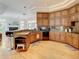 Spacious kitchen featuring custom wood cabinetry, granite countertops and stainless appliances at 8907 Magnolia Chase Cirs, Tampa, FL 33647