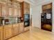 Well-appointed kitchen with wooden cabinets, stainless appliances, and granite countertops at 8907 Magnolia Chase Cirs, Tampa, FL 33647