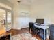 Bright office featuring hardwood floors, white walls, and natural light at 8907 Magnolia Chase Cirs, Tampa, FL 33647