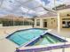 View of the pool and spa in the lanai surrounded by tile and patio at 8907 Magnolia Chase Cirs, Tampa, FL 33647