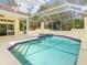 Lanai area features a pool, hot tub, and ample space for outdoor enjoyment at 8907 Magnolia Chase Cirs, Tampa, FL 33647