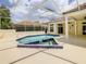 View of the pool in lanai with an adjacent hot tub and patio at 8907 Magnolia Chase Cirs, Tampa, FL 33647