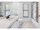 A bathroom featuring a single sink vanity, walk-in shower, and tile flooring at 1061 Archway Dr, Spring Hill, FL 34608