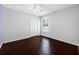 Bedroom with hardwood floors, ceiling fan, and natural light at 1061 Archway Dr, Spring Hill, FL 34608