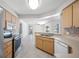 Open concept kitchen featuring stainless steel appliances and tiled floors at 1061 Archway Dr, Spring Hill, FL 34608